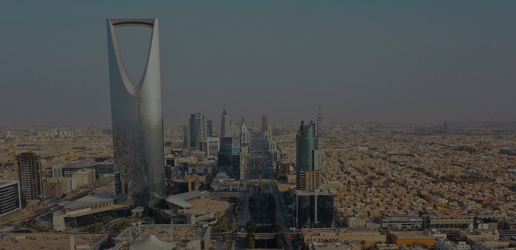 Riyadh skyline with Kingdom Centre and King Fahd Road at dusk